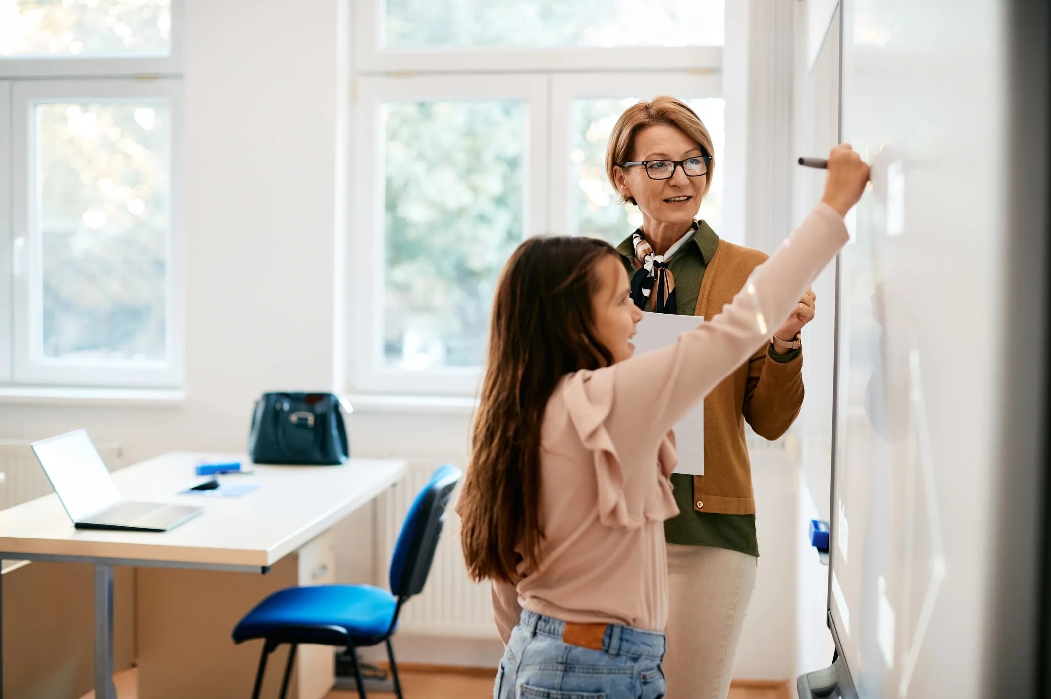 Teacher helping student with exam revision